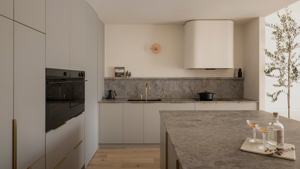 Elegant kitchen with marble countertop and wine rack, reflecting Furnishd's design aesthetic.